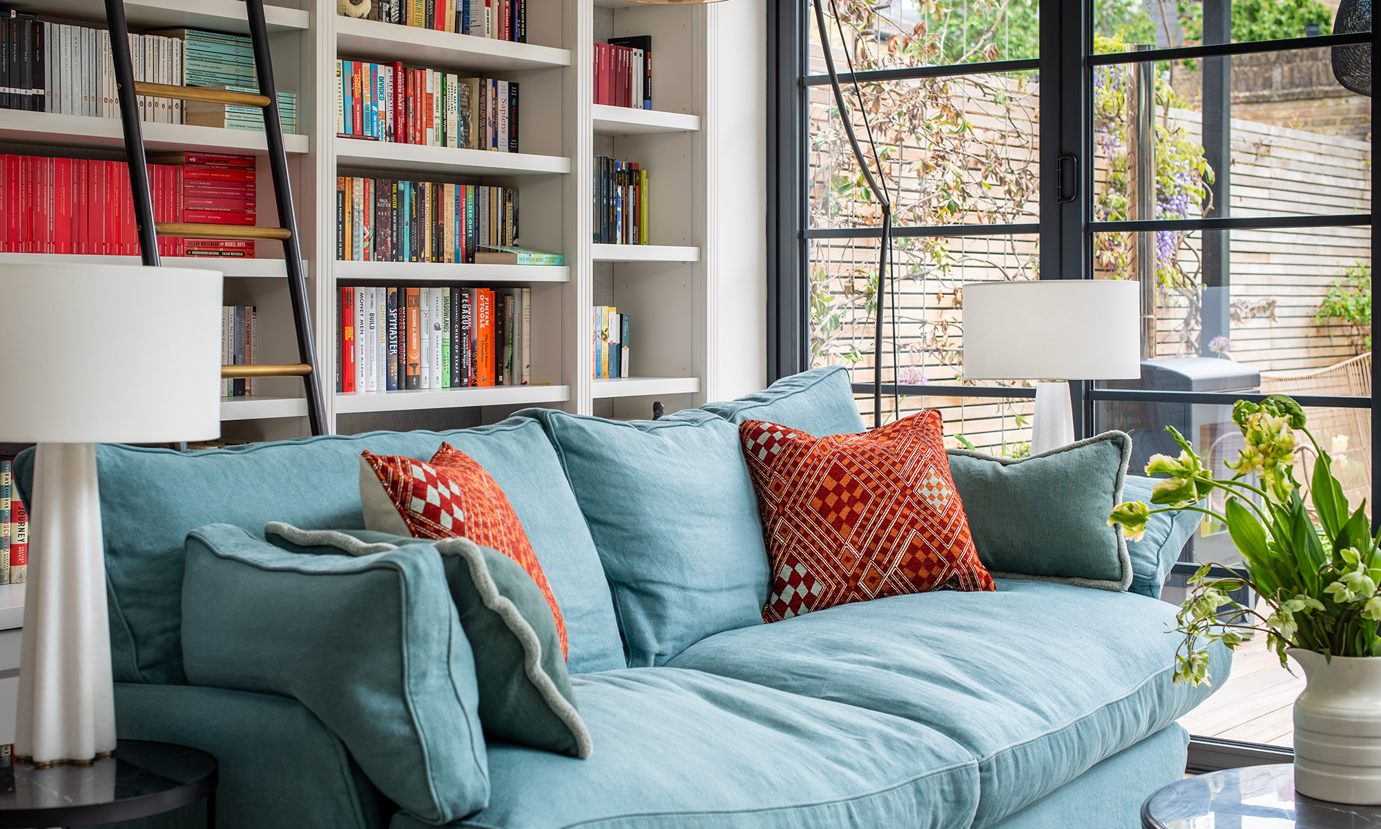 blue sofa in bright library