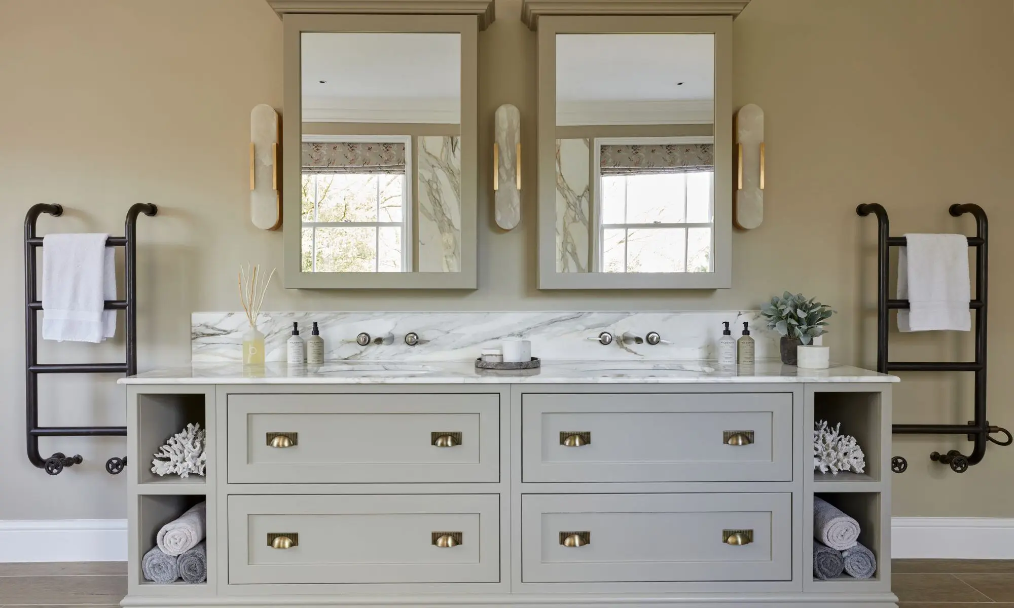 A bathroom with two sinks and two mirrors.