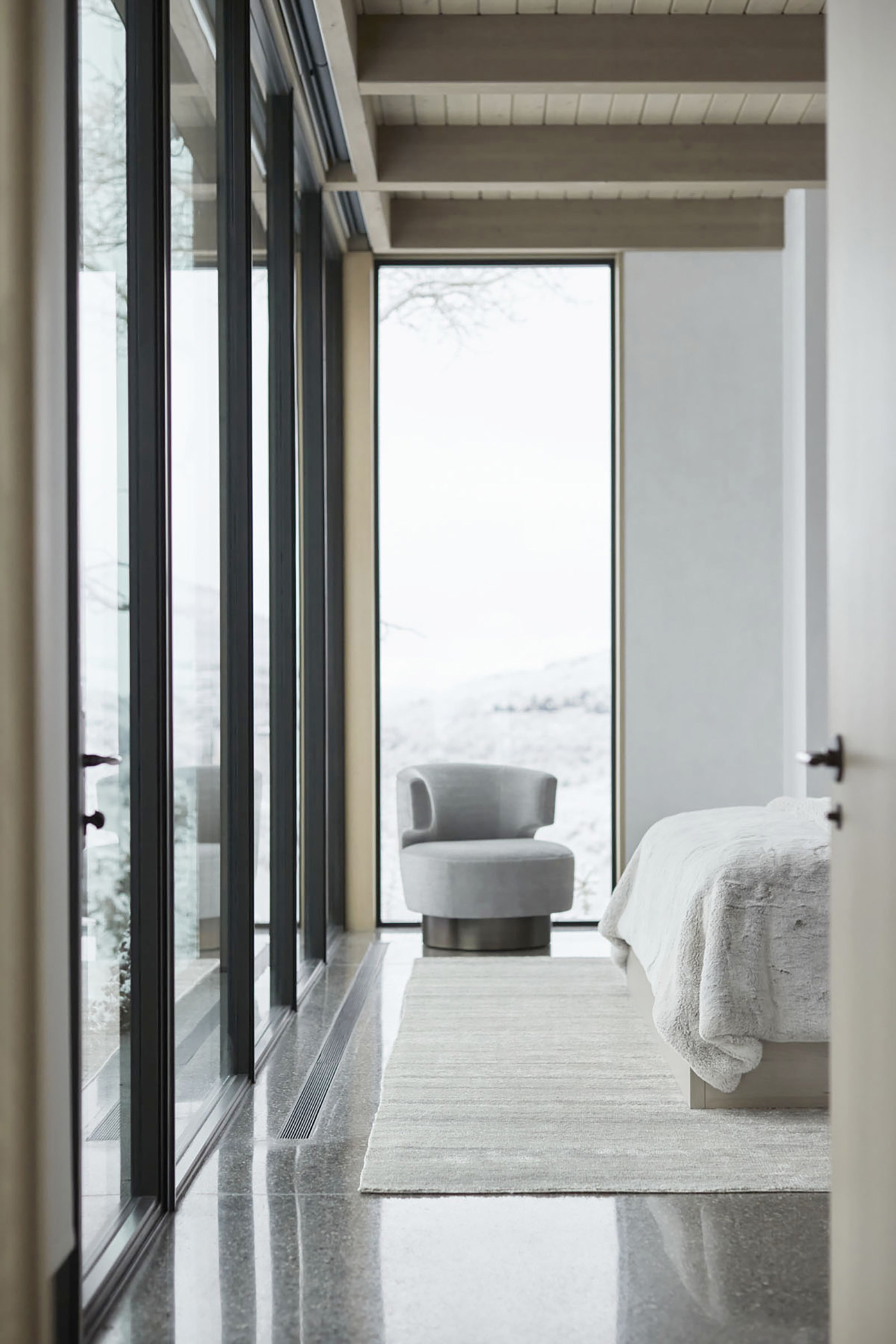 Hallway to bedroom in luxury home