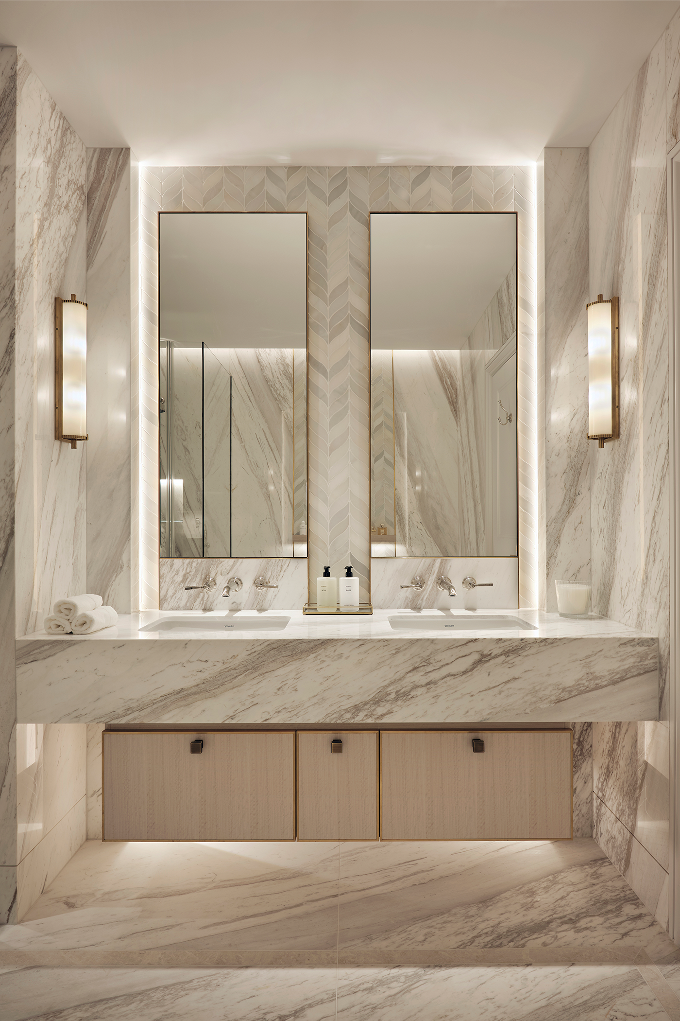 His & hers sinks in marble bathroom