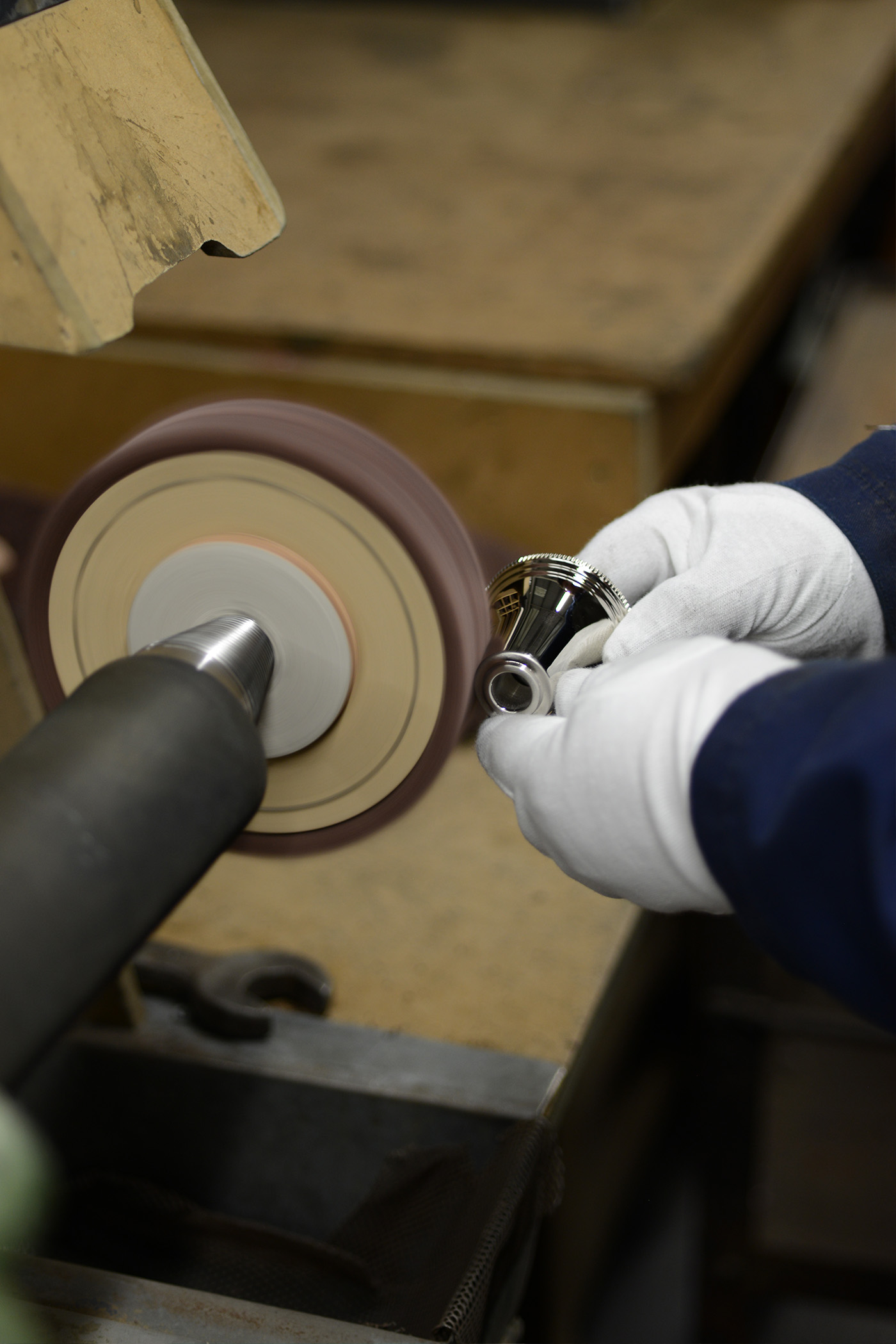Up close of a Polisher's hands brushing a side valve