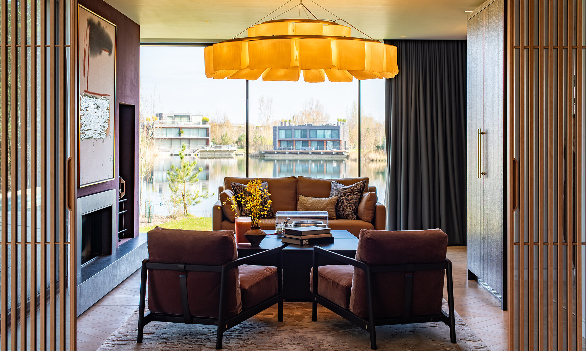 Music room with lake view and bespoke interiors by Atelier 15.4