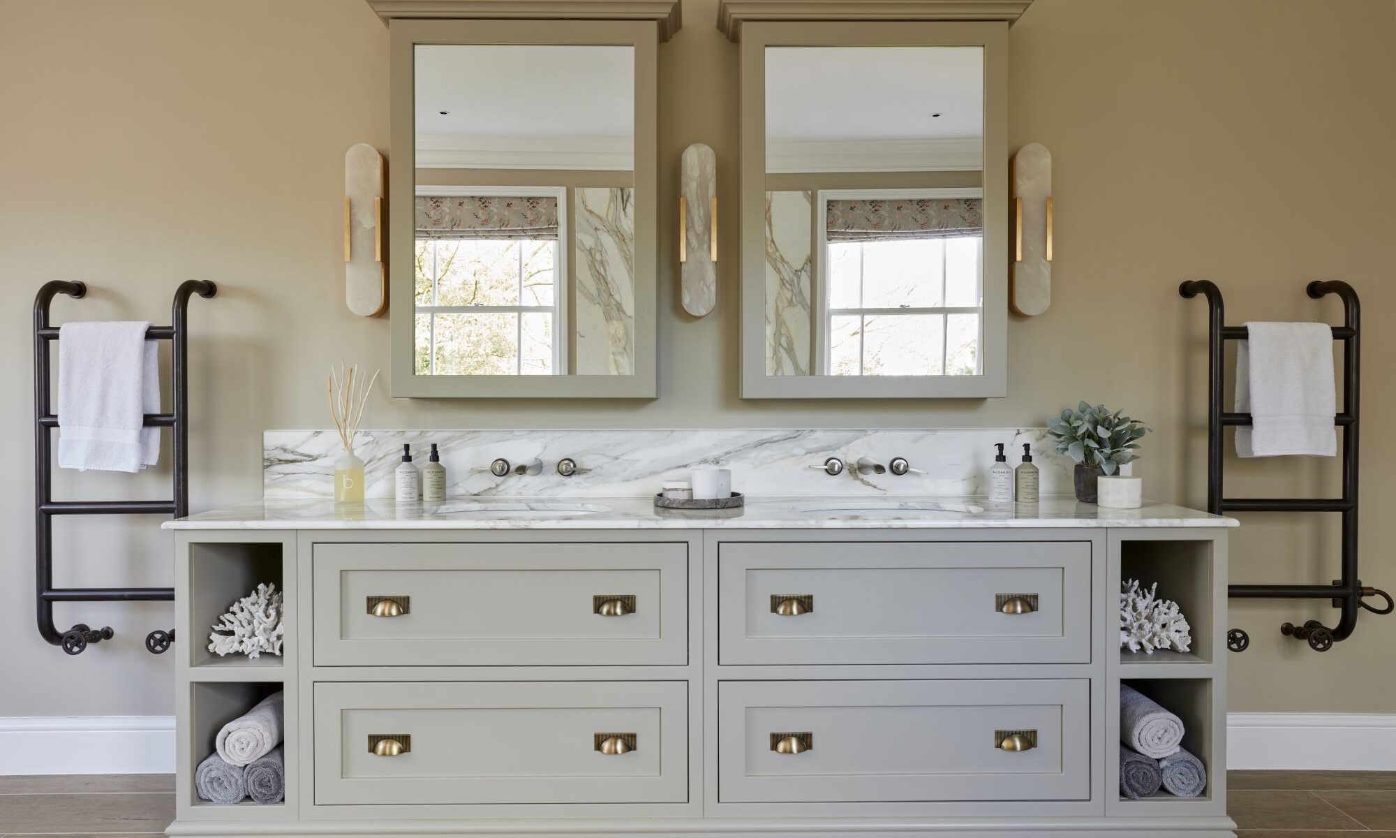 A bathroom with two sinks and two mirrors.
