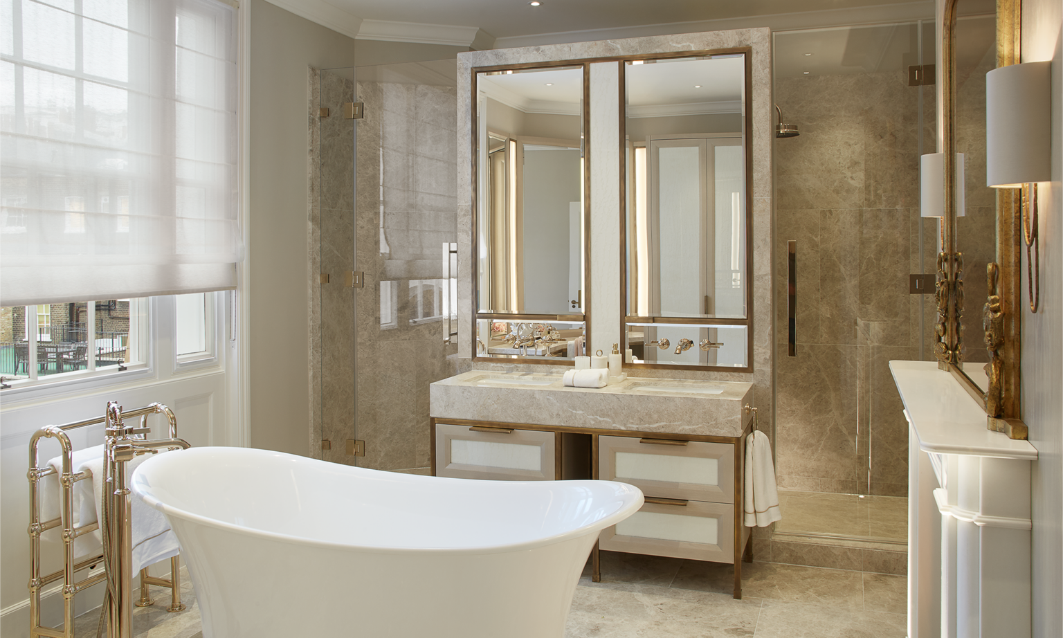 large roll top bath and brass bathroom